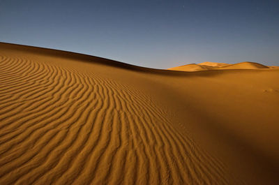 Scenic view of desert against clear sky