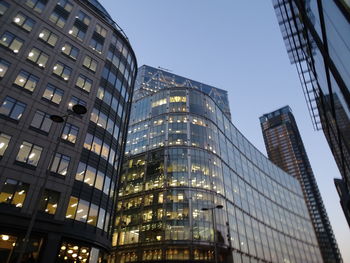 Low angle view of modern buildings against sky in city