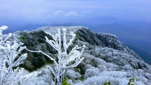 Scenic view of mountains against sky during winter