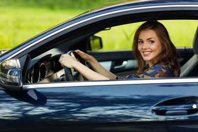 Young woman in car