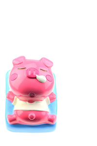 Close-up of pink toy against white background