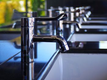 Close-up of faucet in water