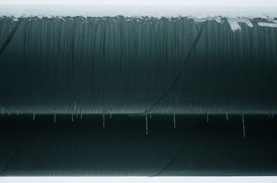 Close-up of frozen pipes during winter
