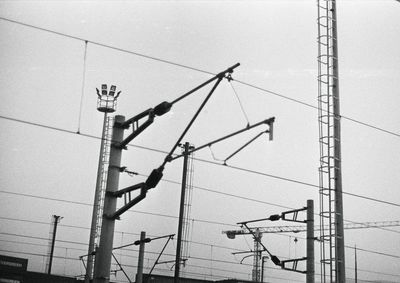 Low angle view of electricity pylon against sky