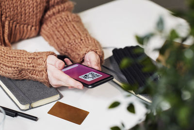 Woman's hands holding cell phone