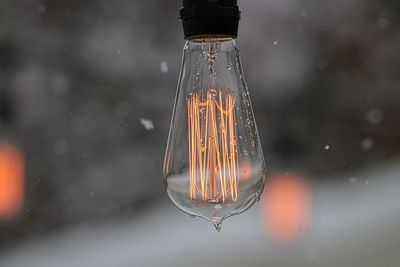 Close-up of illuminated light bulb
