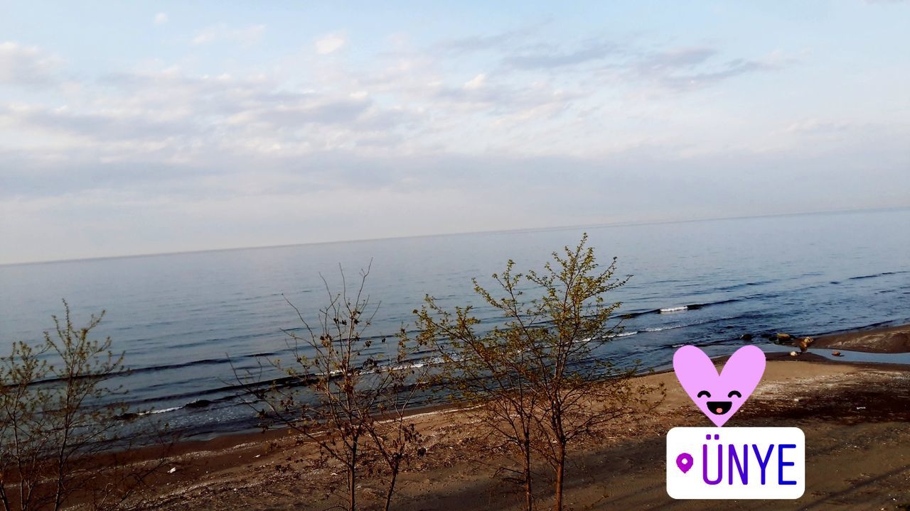 water, sky, horizon over water, horizon, scenics - nature, sea, land, text, nature, tranquil scene, tranquility, cloud - sky, beauty in nature, beach, communication, no people, day, non-urban scene, western script, outdoors, message