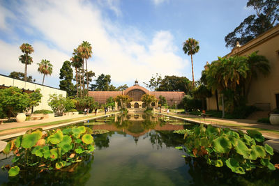 Scenic view of swimming pool by lake against sky