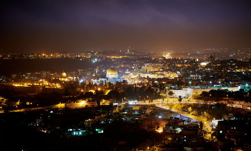 High angle view of illuminated cityscape at night