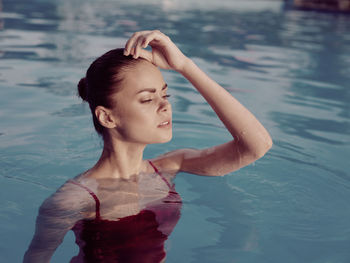 Portrait of woman swimming in pool