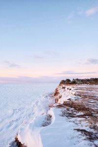 Scenic view of sea against sky during winter