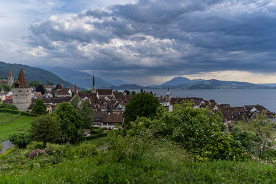 High angle view of townscape zug by lake of zug against sky