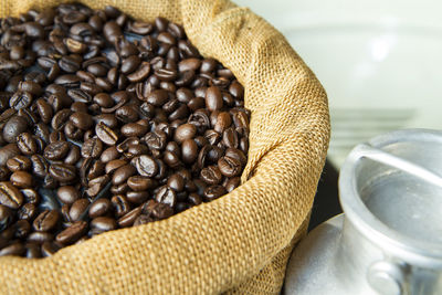 Close up of roasted coffee beans in brown sack