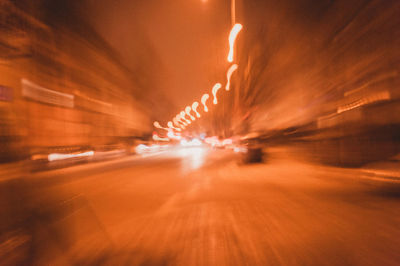 Blurred motion of car on road at night