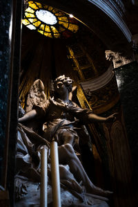 Low angle view of an angel statue in a church in rome 