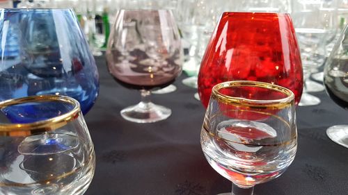 Close-up of wine glasses on table