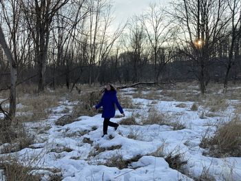 Rear view of man on snow covered land