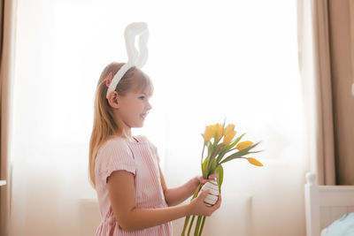 Girl holding flower bouquet