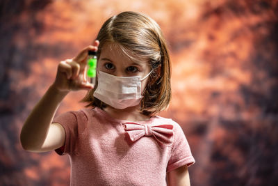 Portrait of a girl holding camera