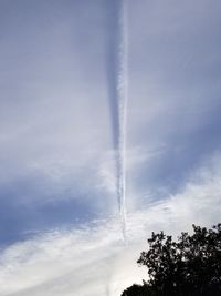 Low angle view of vapor trail against sky