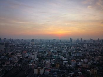 High angle view of buildings against sky during sunset