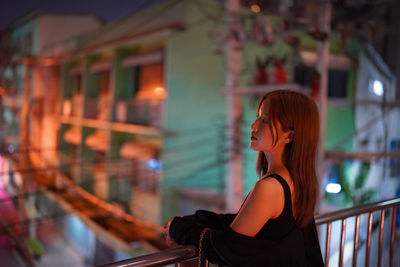 Side view of young woman looking away