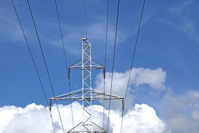 Low angle view of electricity pylon against sky