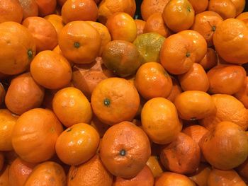 Full frame shot of oranges at market stall