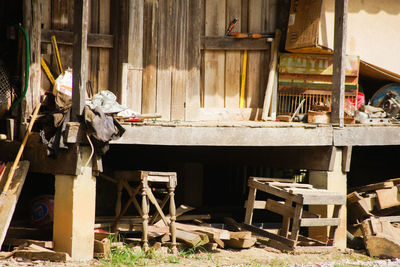 Chairs on table by old building