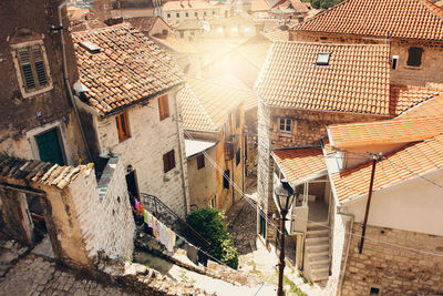 Aerial view from mountain in sunny day on street and houses in kotor old town, montenegro