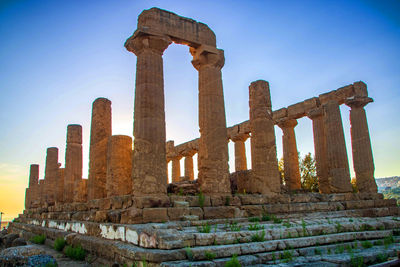 Low angle view of old ruins against clear sky