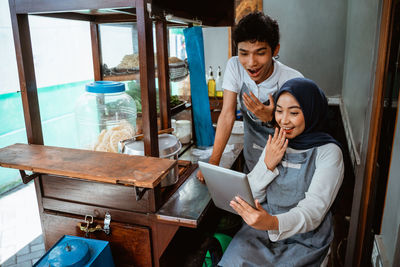 Portrait of young woman using mobile phone