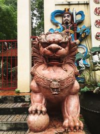 Close-up of statue against building