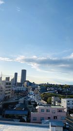 High angle view of buildings in city against sky