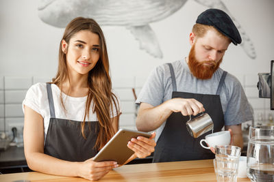 Young couple looking at camera