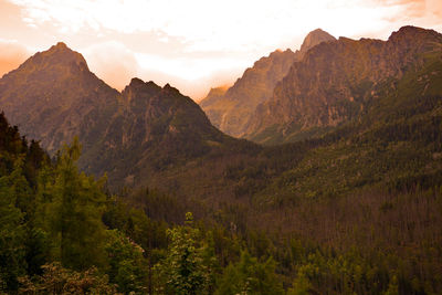 Scenic view of rocky mountains against sky during sunset