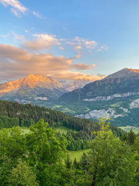 Scenic view of landscape and mountains against sky