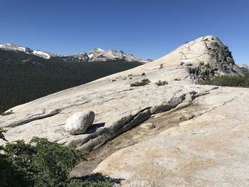 Scenic view of rocky mountains against clear blue sky