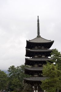 Low angle view of pagoda against sky