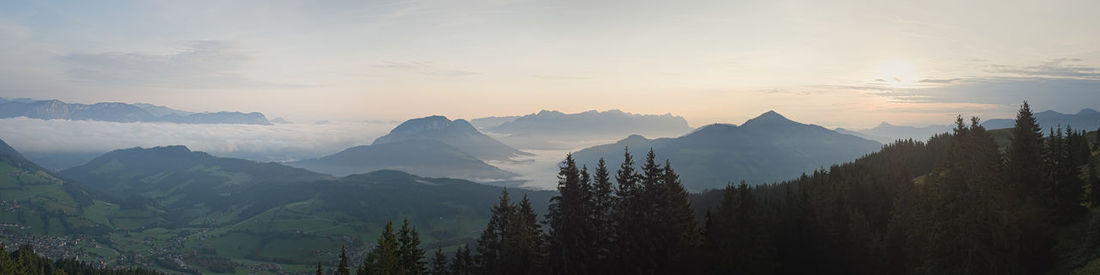 Panoramic view of mountains against sky during sunset