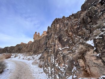 Rock formations on mountain against sky