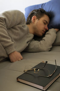 Rear view of man sitting on sofa at home