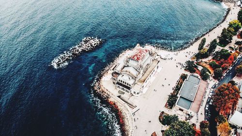 High angle view of swimming pool by sea in city