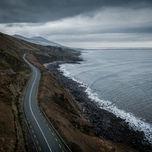 High angle view of road by sea against sky