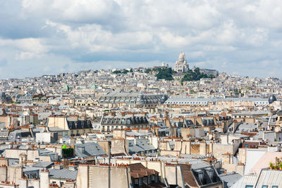 High angle view of buildings in city against sky