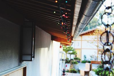 Illuminated string lights decorated on house roof