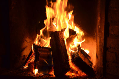 Close-up of fire burning in fireplace