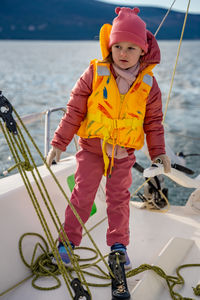 Rear view of man skiing on sea