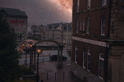 Buildings in city at night