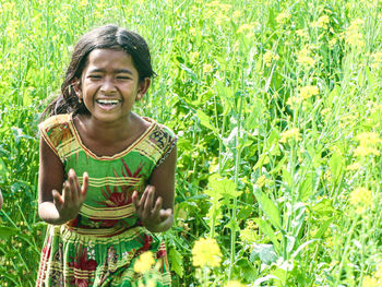 Portrait of a smiling girl on field